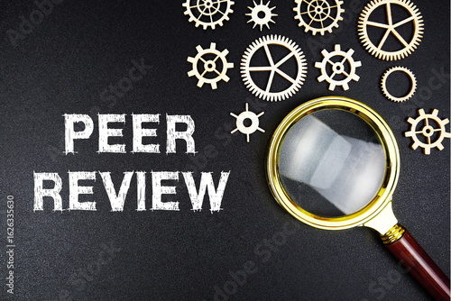 Bild auf Leinwand Peer Review text message with magnifying glass on black background