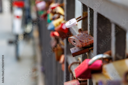 One of many padlocks at a bridge railing, symbolizing eternal love (locked and key thrown into the river)