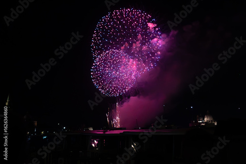 A photo of fireworks in the night sky