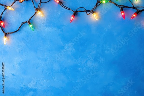 Colorful Christmas Lights on Blue Background Creating a Festive Atmosphere for Holiday Celebrations, Party Decorations, or Creative Seasonal Projects