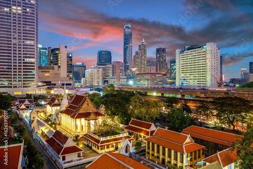 Wat Pathumwanaram Temple in the morning, view from Siam Paragon car park in Bangkok, Thailand.