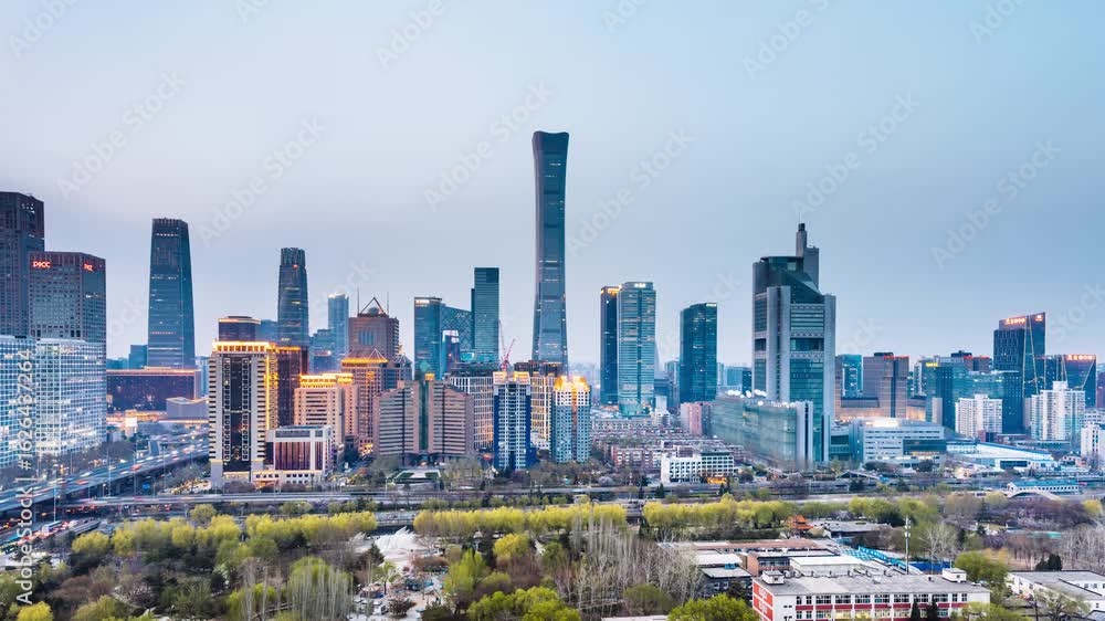 High angle night view Day-to-Night timelapse of International Trade Center CBD complex and overpass in Beijing, China