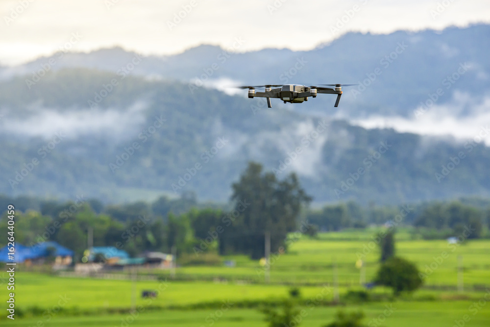 Drone copter flying with digital camera in mountains. Drone copter flying with digital camera in mountains.