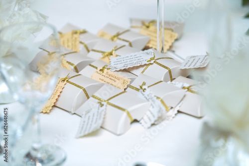 Beautifully wrapped party favors create an elegant display on a festive table during a joyful celebration