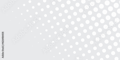 Abstract Grey and White Polka Dot Pattern with Gradual Density.