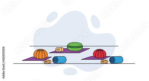 Yoga equipment on mats with abstract background