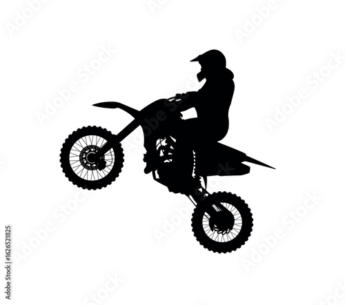 Silhouette of Motocross Rider Jumping Uphill in the Air