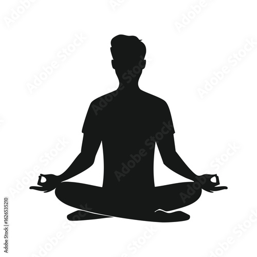 Silhouette of a man in a meditative lotus yoga pose. A concept of mindfulness, spiritual wellness, harmony, and inner peace.