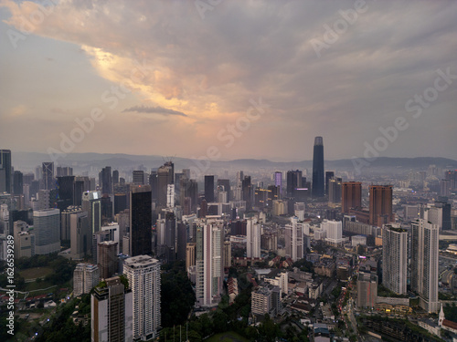 Wallpaper Mural Aerial view of skyscrapers piercing through the morning haze, bathed in the soft glow of the rising sun over the cityscape, Kuala Lumpur, Kuala Lumpur, Malaysia. Torontodigital.ca
