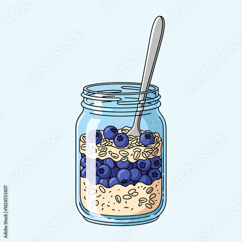 Healthy overnight oats with fresh blueberries layered in a glass jar with a spoon