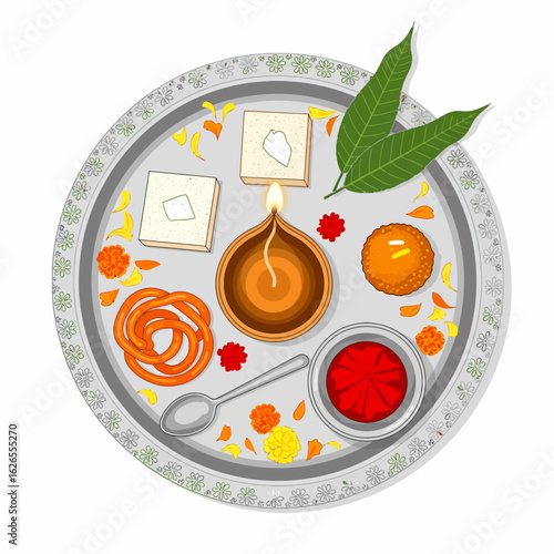 A decorative puja thali with sweets diya and marigold flowers for Hindu festivals