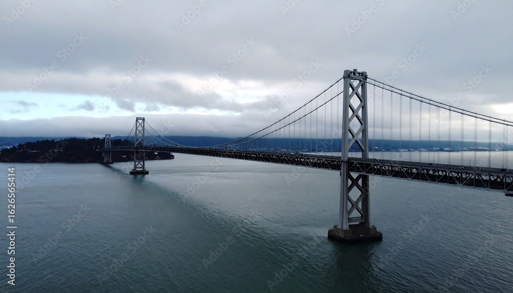 Fototapeta premium A bridge spanning a gray waterway