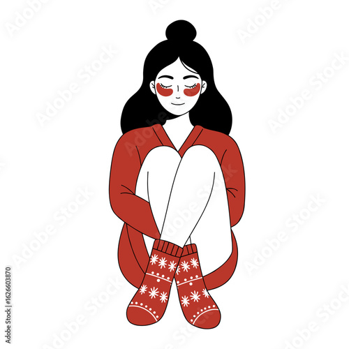 Young woman sitting cozy in red sweater and festive socks  