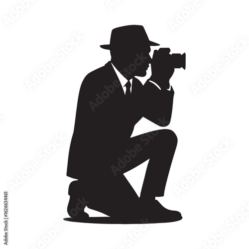 Silhouette of Photographer in Hat Taking Photo on One Knee

