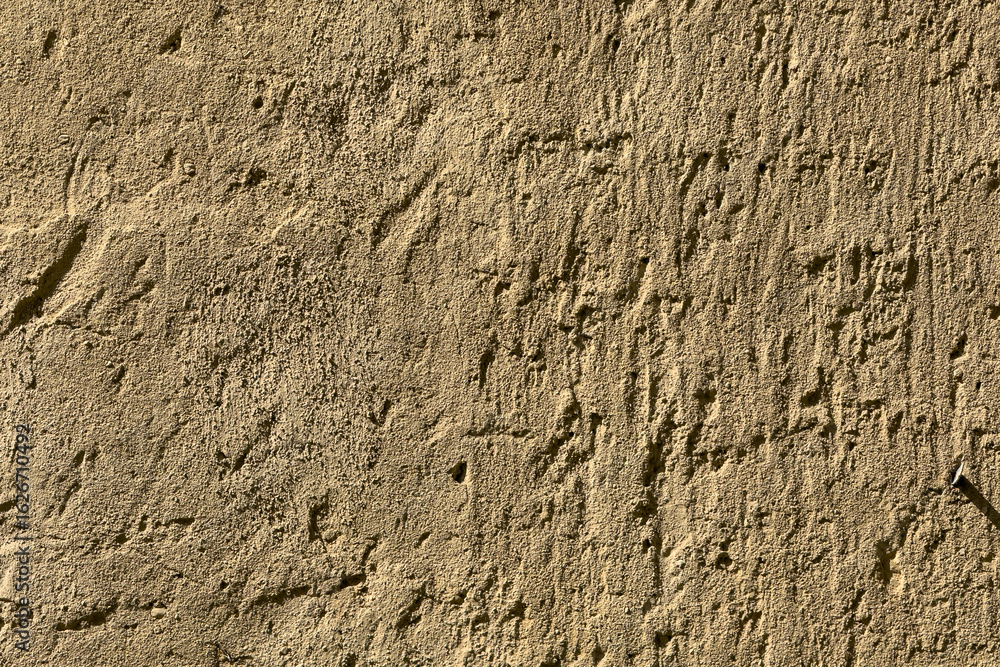 Scratchy stucco wall surface makes textured background plate Scratchy stucco wall surface makes textured background plate