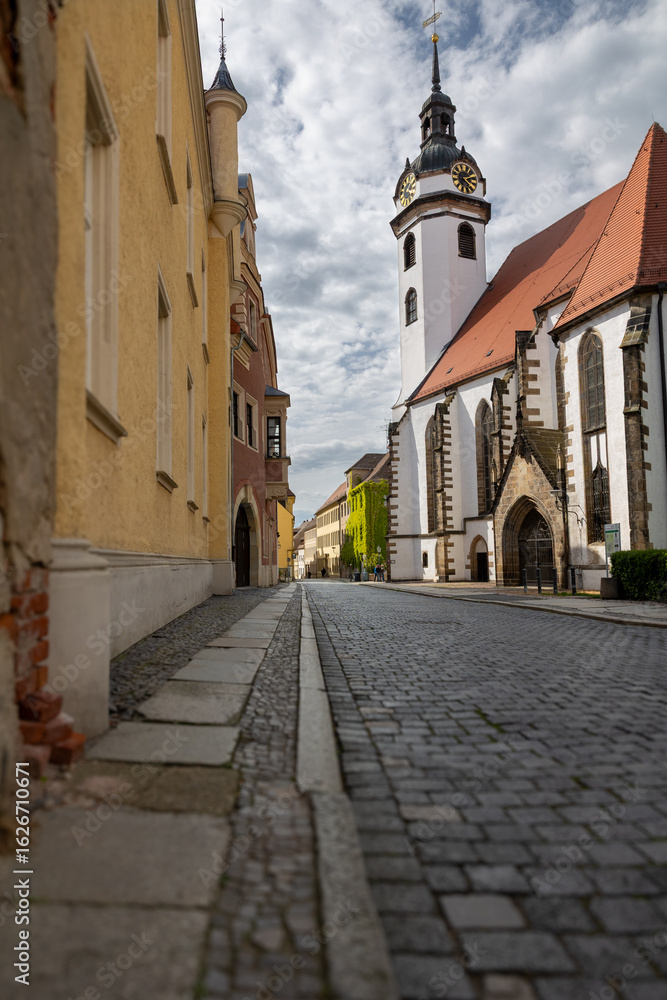 Fototapeta premium Vertical shot shows European architecture along quaint street in Germany