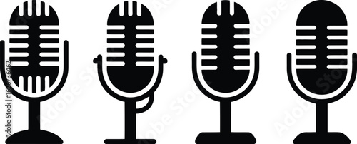 Four vintage style microphones in a row on white background