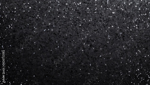 a textured black surface with glittering specks ideal for backgrounds and designs