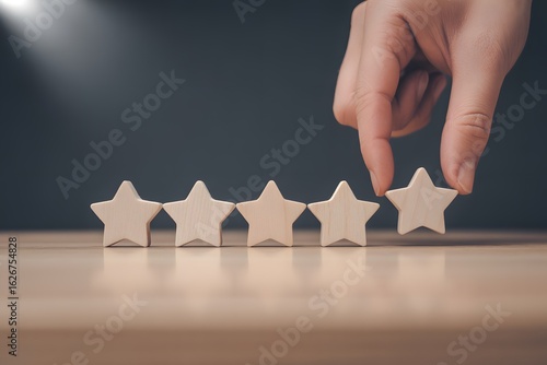 Elevating Excellence: A hand delicately places the final star, completing the perfect rating, symbolizing exceptional customer satisfaction and service quality.