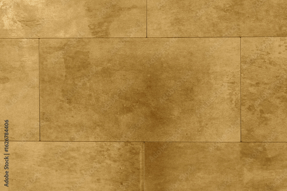 Fototapeta premium Distressed aged weathered gold tiles background backdrop. Interior design building product concept.
