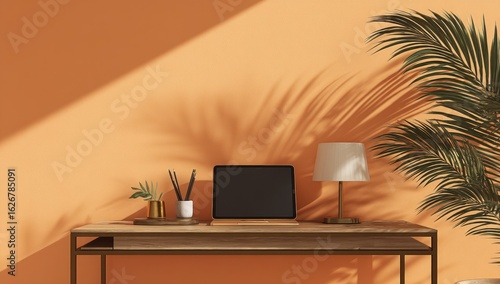 Wallpaper Mural Warm workspace with digital tablet and plant Torontodigital.ca