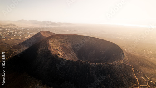 Konstfotografi Aerial drone shot of a dramatic volcanic crater at sunset on Fuerteventura