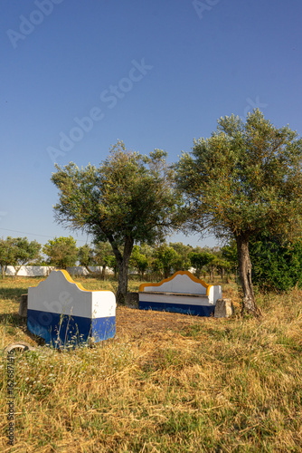 Wallpaper Mural Traditional Alentejo countryside benches painted in vibrant blue and yellow, showcasing the region’s iconic colors and rural charm. Torontodigital.ca