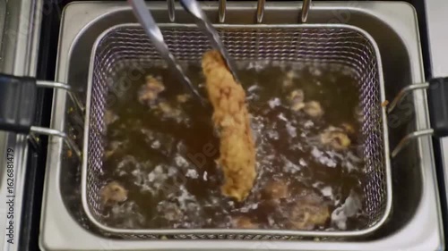 Crispy Chicken Zinger Fillet Frying in Deep Fryer