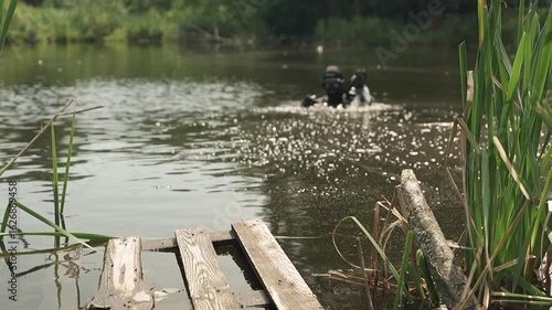 Sappers check lake for explosive devices after fighting in Ukraine