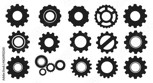 Collection of diverse black silhouette gears and cogwheels isolated on a white background representing mechanics and industry