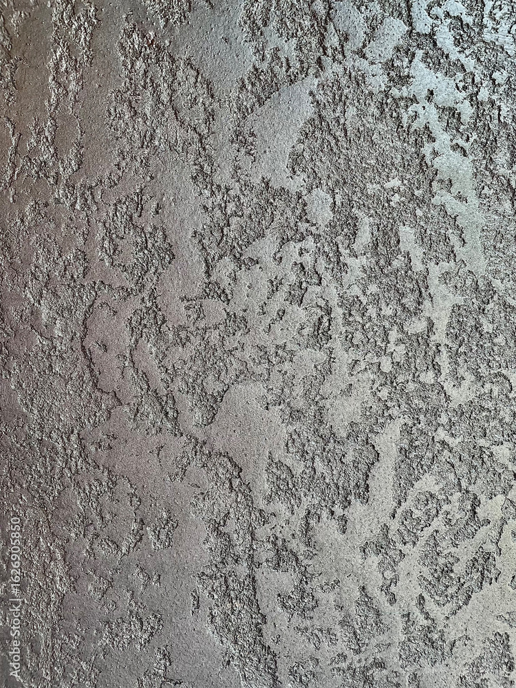 Fototapeta premium Close-up of gray wall texture with a subtle shiny or metallic finish, highlighting smooth surface and reflective details. Ideal for modern interior, design, and architectural themes