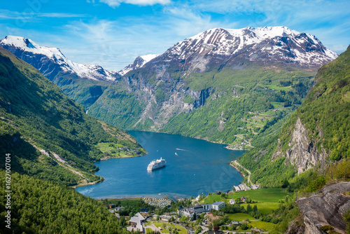 Bild auf Leinwand Geiranger leading into Gierangerfjord from the snowcapped Dalsnibba Pass mountai