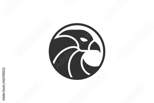 Sleek gray eagle head faces forward within a circular shape gracefully outlined