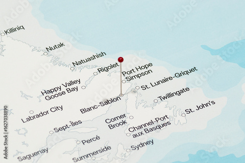 red pin needle into Blanc-Sablon city of Canada political map