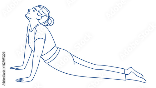 Woman Practicing Yoga in Cobra Pose indoors in Calm and Serene Environment