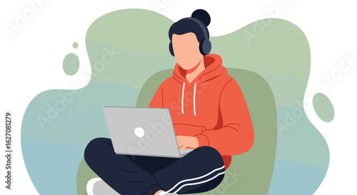 Casual individual working remotely or studying online with a laptop and headphones, perfect for modern digital lifestyle content.