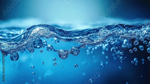Close-up of sparkling water surface with rising bubbles in a vibrant blue background conveying freshness and purity