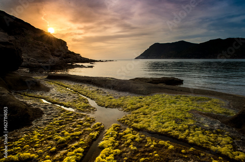 sunset over the sea, Porto Ferro, Alghero, Sardinia, Italy