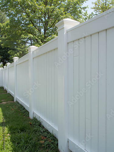 Contemporary White vinyl fence enclosing a backyard