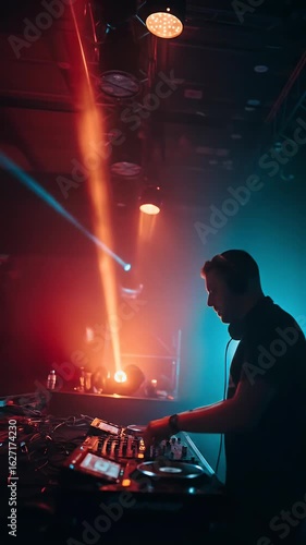 Nightlife Video of DJ Performing Music With Red and Blue Lights