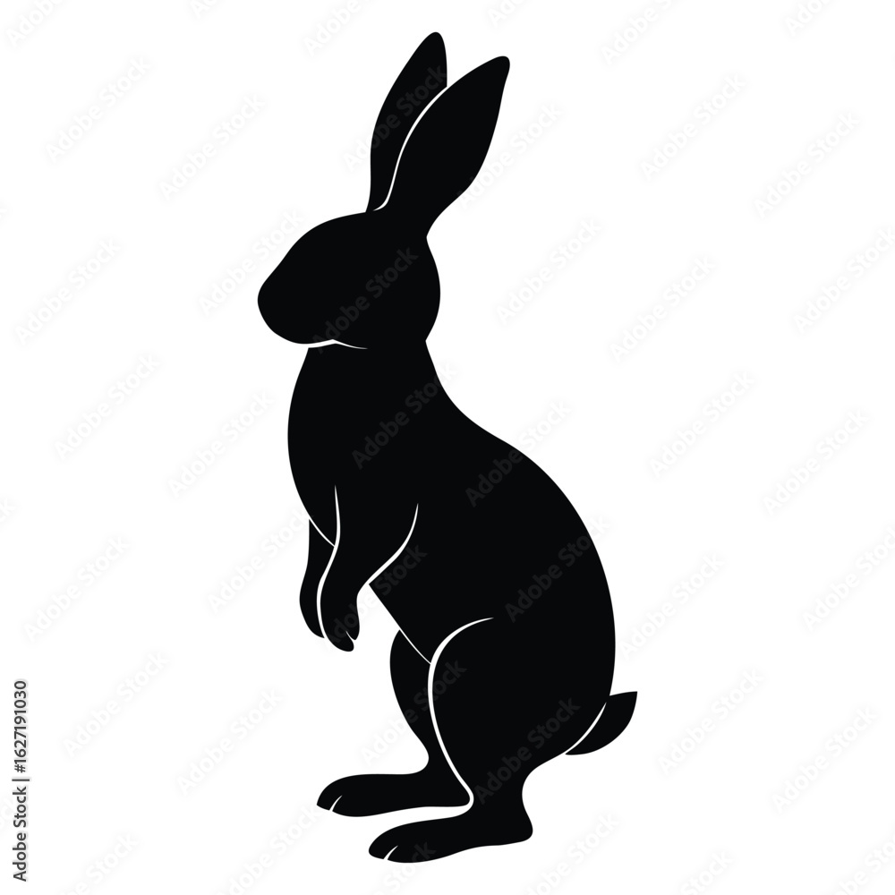 Fototapeta premium Black silhouette of a rabbit standing on hind legs with ears upright bunny hare