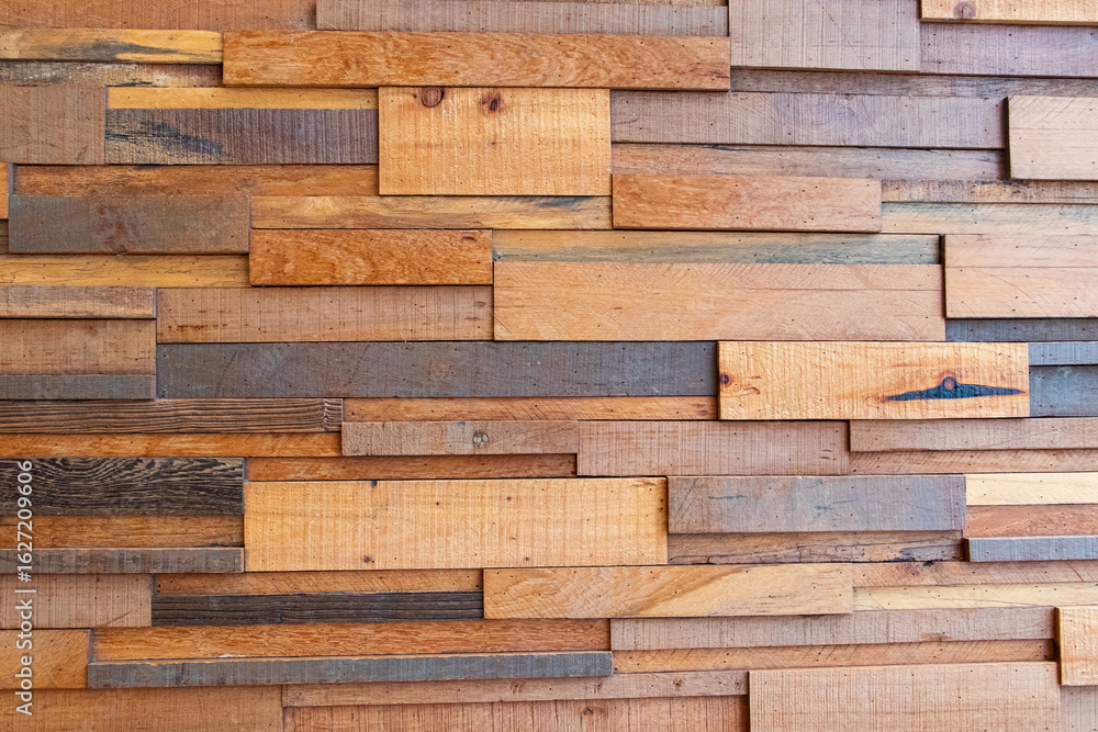 Fototapeta premium Photo of Vintage old wall house structure brown shiny wooden plank Lay horizontally as pattern. Abstract texture. House wall for background or website wallpaper. Wooden board.