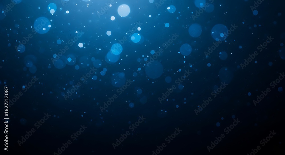 Obraz premium Abstract background of glowing blue bokeh lights in the dark water