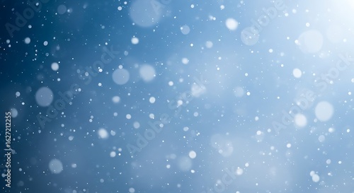 Soft focus blue background with falling snowflakes and bokeh lights
