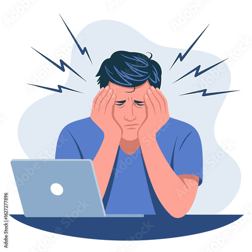 Man holding his head in frustration while sitting at a desk with a laptop open
