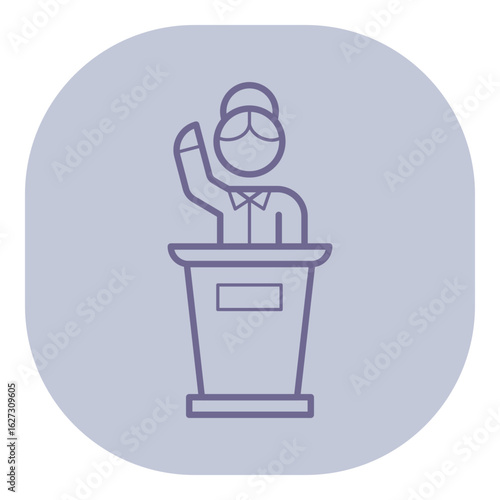 Person standing at podium, raising one hand in gesture suggesting speaking or addressing audience. Presentation or conference concept