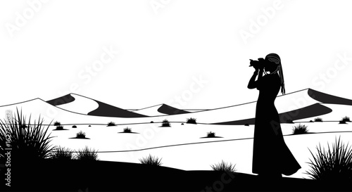a serene silhouette of a photographer capturing the majestic beauty of rolling sand dunes at sunset, isolated on a transparent background