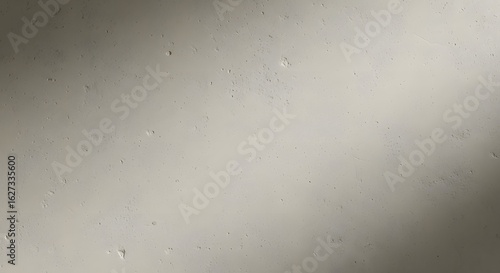 Raw cement wall with visible pores, uneven texture, and diagonal shadows, perfect for architectural mockups, minimalist backgrounds, or industrial design references