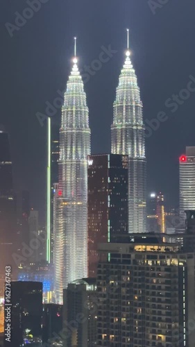 Malaysia, Kualu Lumpur - 05.07.2025 - Petronas Towers in the evening. A beautiful skyscraper in Asia, an incredibly tall building, a landmark in Malaysia. Evening shooting of skyscrapers