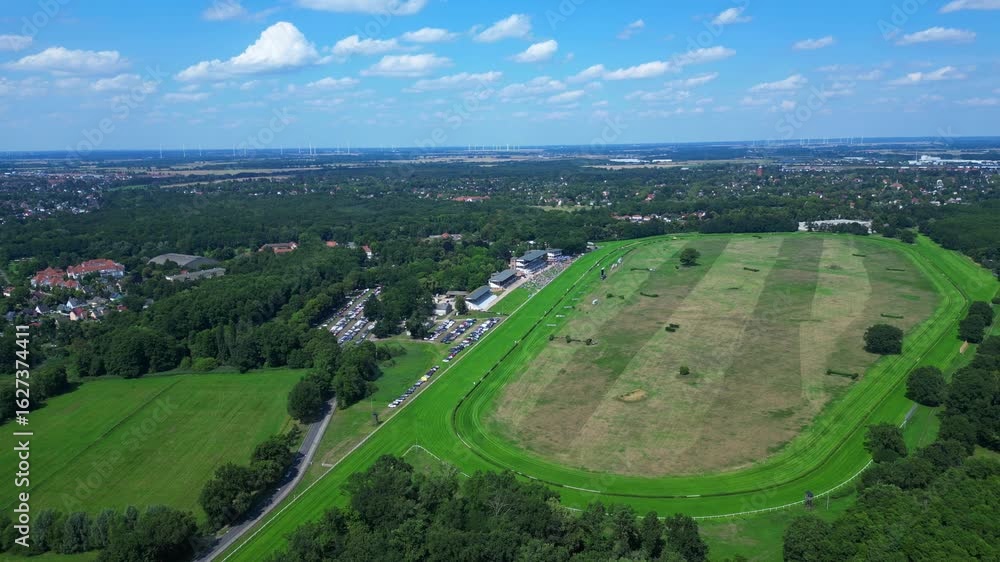 Jockeys on racehorses on horse racing track, showcasing the vibrant green turf, stands filled with spectator landscape beyond. Gorgeous aerial view flight speed ramp hyper motion time lapse Jockeys on racehorses on horse racing track, showcasing the vibrant green turf, stands filled with spectator landscape beyond. Gorgeous aerial view flight speed ramp hyper motion time lapse